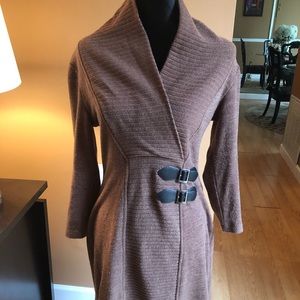 High neck sweater dress with accent straps.